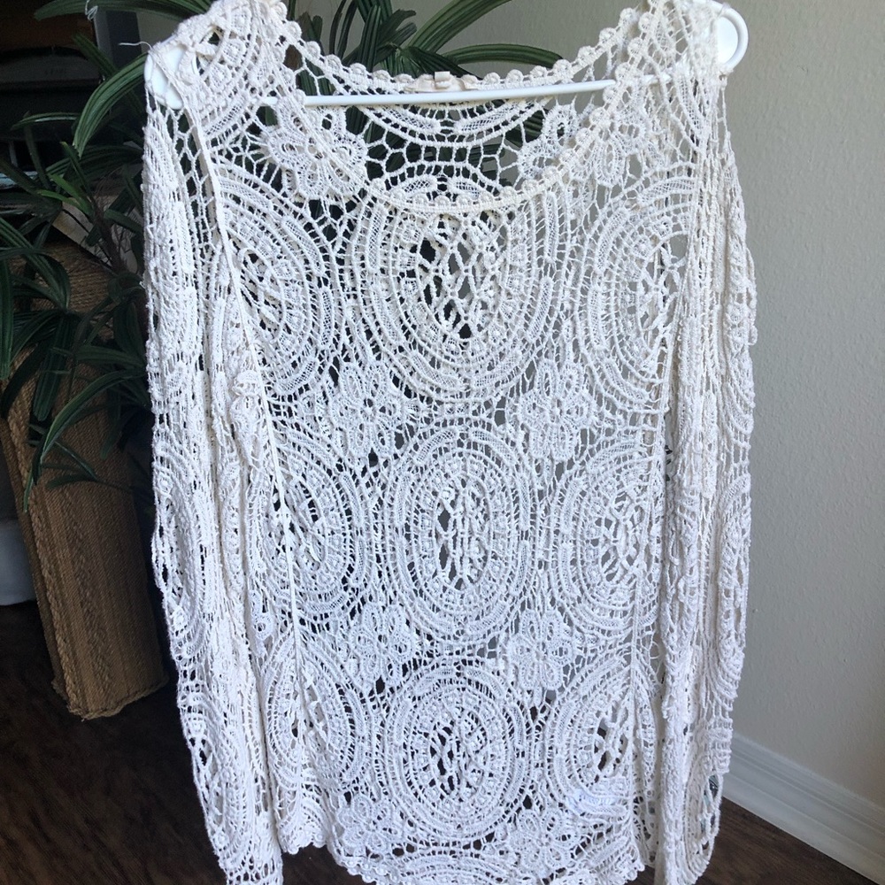Cream colored laced top.